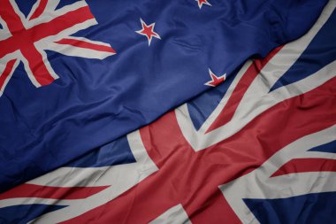 büyük Britanya ve Yeni Zelanda ulusal bayrağı renkli bayrak sallayarak.