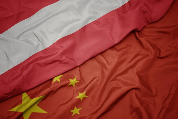 Waving colorful flag of china and national flag of austria. — Stock Photo, Image