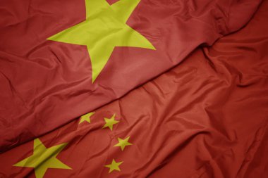 çin ve vietnam ulusal bayrağı renkli bayrak sallayarak.