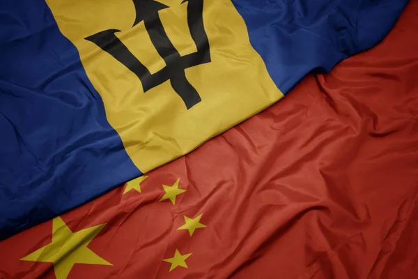 Waving colorful flag of china and national flag of barbados. — Stock Photo, Image