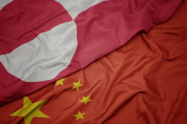 Waving colorful flag of china and national flag of greenland. — Stock Photo, Image