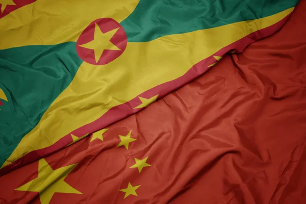 Çin ve grenada ulusal bayrağı renkli bayrak sallayarak. — Stok fotoğraf