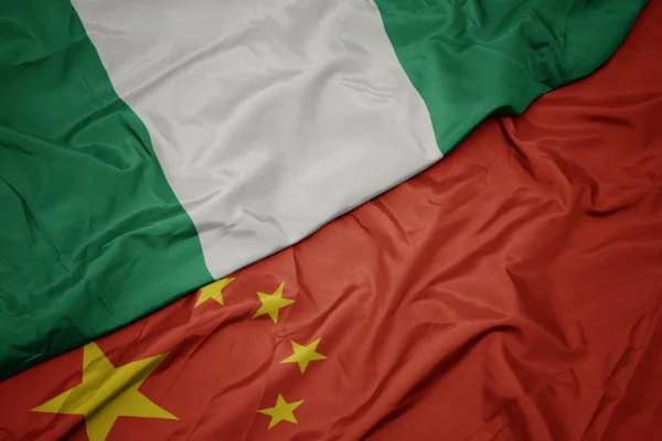 Waving colorful flag of china and national flag of nigeria. — Stock Photo, Image