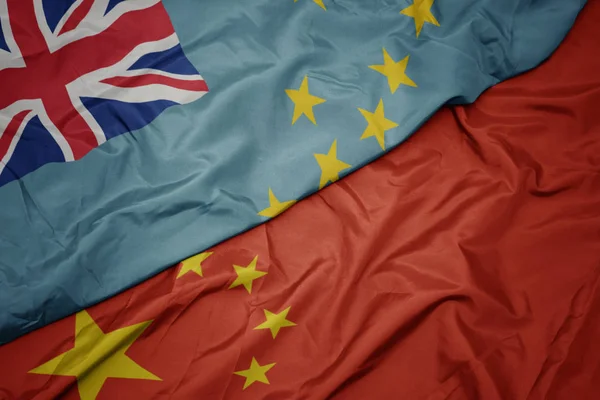 Waving colorful flag of china and national flag of Tuvalu. — Stock Photo, Image