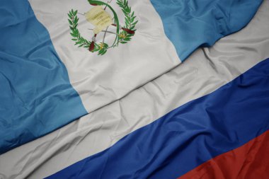 Rusya ve guatemala ulusal bayrağı renkli bayrak sallayarak.