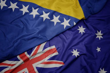 Avustralya ve bosna-hersek ulusal bayrağı renkli bayrak sallayarak.