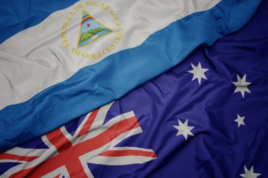 Avustralya ve nikaragua ulusal bayrağı renkli bayrak sallayarak.