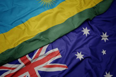 Avustralya ve ruanda ulusal bayrağı renkli bayrak sallayarak.