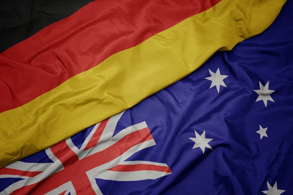 オーストラリアのカラフルな旗とドイツの国旗を振る. — ストック写真