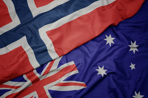 Acenando bandeira colorida da Austrália e bandeira nacional do norway . — Fotografia de Stock