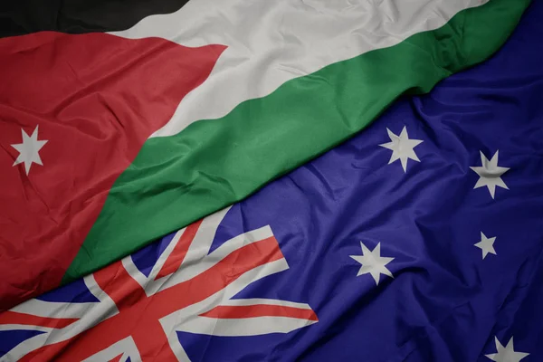 Waving colorful flag of australia and national flag of jordan. — Stock Photo, Image