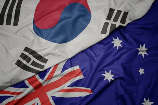 オーストラリアのカラフルな旗と韓国の国旗を振る. — ストック写真