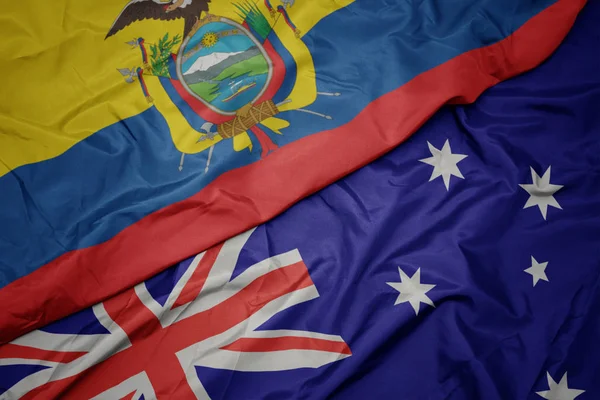 Schwenken bunte Flagge Australiens und Nationalflagge Ecuadors. — Stockfoto