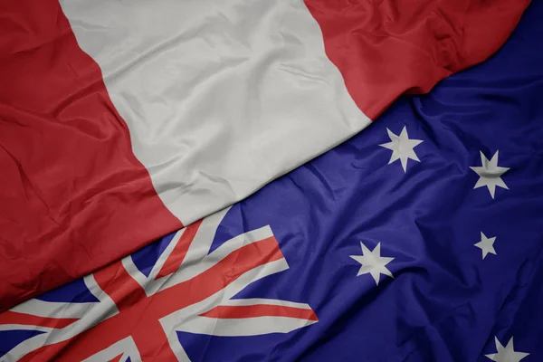 Az ausztrál zászló színpompás zászlója és Peru nemzeti zászlaja hullámzó. — Stock Fotó