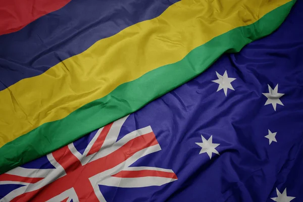 Waving colorful flag of australia and national flag of mauritius. — Stock Photo, Image