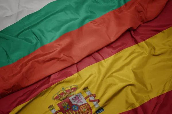 Waving colorful flag of spain and national flag of bulgaria. — Stock Photo, Image