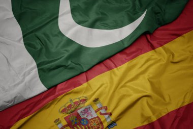 İspanya ve pakistan ulusal bayrağı renkli bayrak sallayarak.