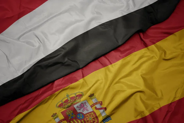 Integetett Spanyolország és Jemen zászlaja. — Stock Fotó