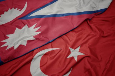türkiye ve nepal ulusal bayrağı renkli bayrak sallayarak.