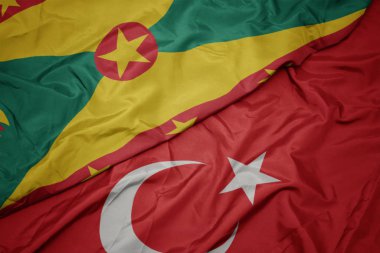 türkiye ve grenada ulusal bayrağı renkli bayrak sallayarak.