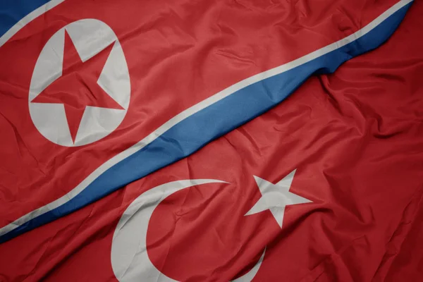 Sventolando bandiera colorata di tacchino e bandiera nazionale della Corea del Nord . — Foto Stock