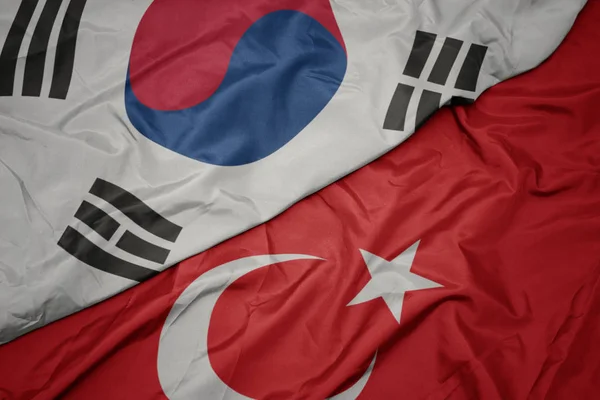 Ondeando colorida bandera de pavo y bandera nacional de Corea del Sur . —  Fotos de Stock