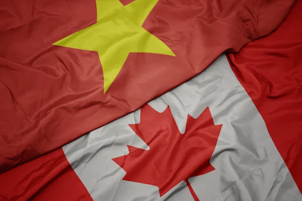 カナダのカラフルな旗とベトナムの国旗を振る. — ストック写真