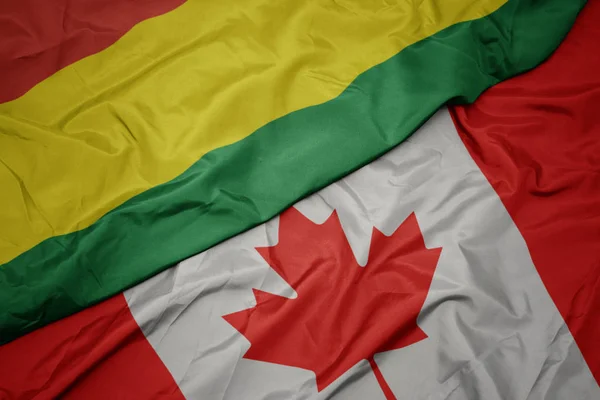 カナダのカラフルな旗とボリビアの国旗を振る. — ストック写真