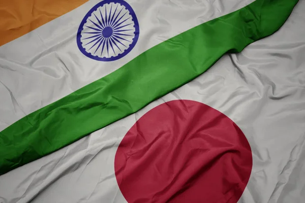 waving colorful flag of japan and national flag of india.
