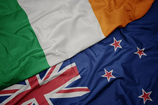 Waving colorful flag of new zealand and national flag of ireland. — Stock Photo, Image