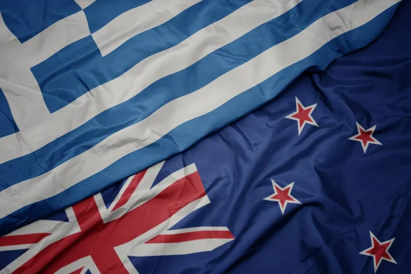 Waving colorful flag of new zealand and national flag of greece. — Stock Photo, Image