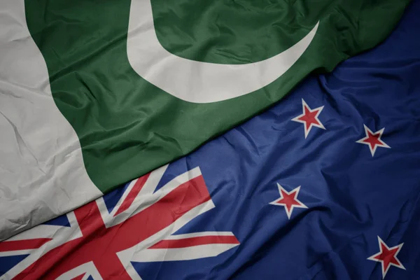 Waving colorful flag of new zealand and national flag of pakistan. — Stock Photo, Image