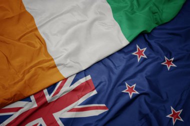 yeni zelanda ve cote divoire ulusal bayrağı renkli bayrak sallayarak.