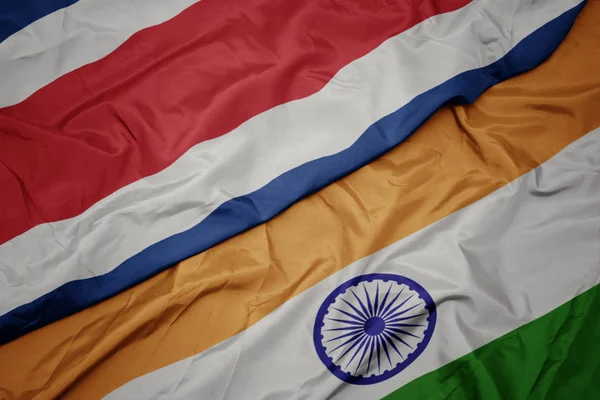 挥舞着五颜六色的印度国旗和哥斯达黎加国旗. — 图库照片