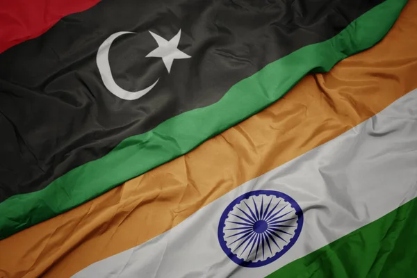 Waving colorful flag of india and national flag of libya. — Stock Photo, Image