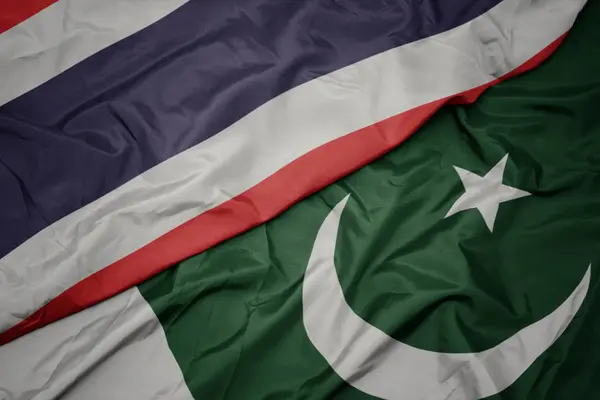 Waving colorful flag of pakistan and national flag of thailand. — Stock Photo, Image