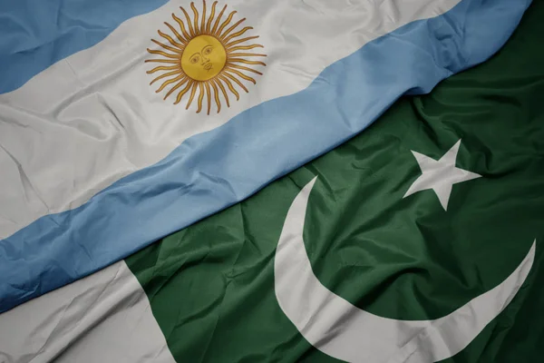 Waving colorful flag of pakistan and national flag of argentina. — Stock Photo, Image