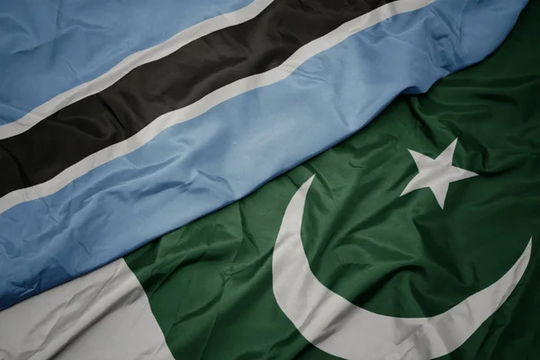 Waving colorful flag of pakistan and national flag of botswana. — Stock Photo, Image