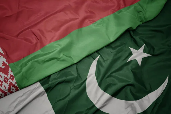 Waving colorful flag of pakistan and national flag of belarus. — Stock Photo, Image