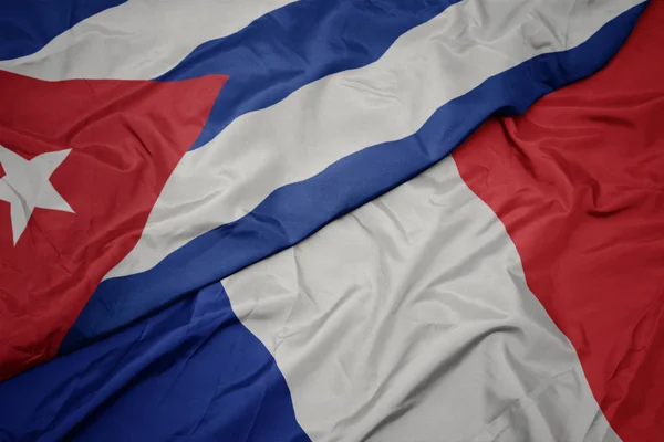 Waving colorful flag of france and national flag of cuba — Stock Photo, Image