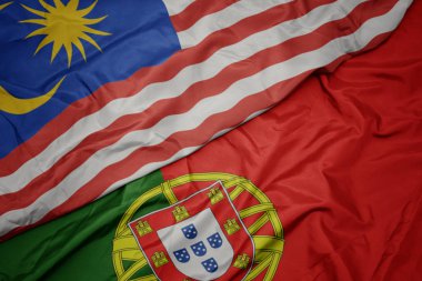 portekiz ve malezya ulusal bayrağı renkli bayrak sallayarak.