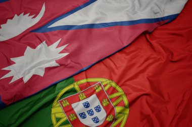 portekiz ve nepal ulusal bayrağı renkli bayrak sallayarak.