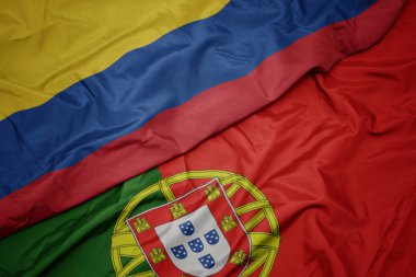 portekiz ve kolombiya ulusal bayrağı renkli bayrak sallayarak.