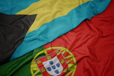 portekiz ve bahamalar ulusal bayrağı renkli bayrak sallayarak.