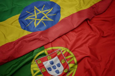 portekiz ve etiyopya ulusal bayrağı renkli bayrak sallayarak.