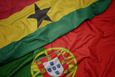 portekiz ve gana ulusal bayrağı renkli bayrak sallayarak.