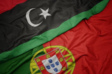 portekiz ve libya ulusal bayrağı renkli bayrak sallayarak.