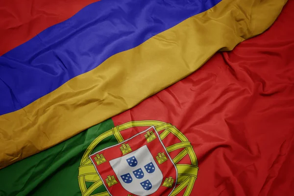 Vinker farverige flag portugal og nationale flag armenien . - Stock-foto