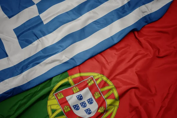 portekiz ve yunanistan ulusal bayrağı renkli bayrak sallayarak.