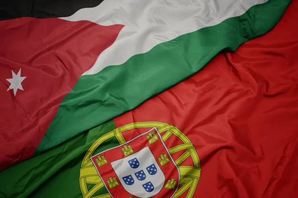 portekiz ve ürdün ulusal bayrağı renkli bayrak sallayarak.